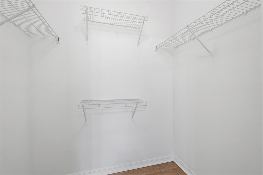 6492 Emerald Dunes Drive, Unit 208 West Palm Beach, FL 33411 - Photo 13 of 37 a view of a room with racks on the wall