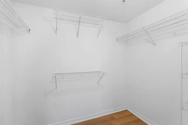 a bathroom with a shower sink and mirror