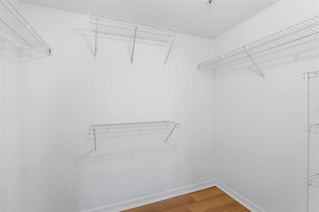 6492 Emerald Dunes Drive, Unit 208 West Palm Beach, FL 33411 - Photo 19 of 37 a view of a room with racks on the wall