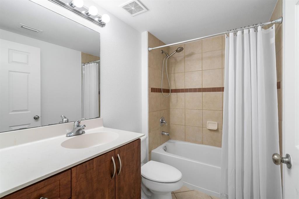 6492 Emerald Dunes Drive, Unit 208 West Palm Beach, FL 33411 - Photo 22 of 37 a bathroom with a sink toilet and shower