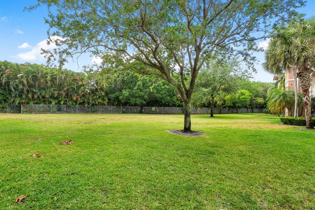6492 Emerald Dunes Drive, Unit 208 West Palm Beach, FL 33411 - Photo 29 of 37 a view of a yard with a trees