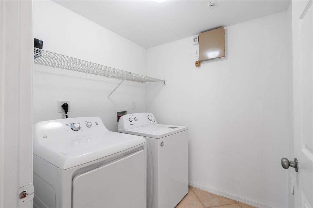 6492 Emerald Dunes Drive, Unit 208 West Palm Beach, FL 33411 - Photo 10 of 37 a utility room with dryer and washer