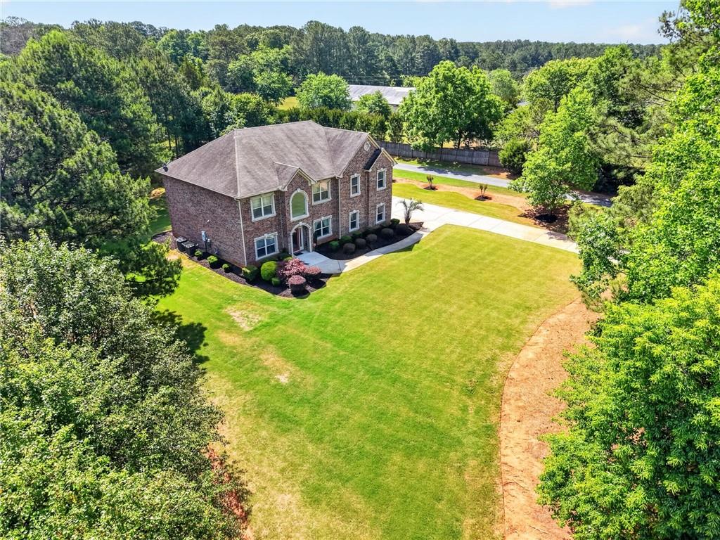 2300 Tucker Mill Road Southwest Conyers, GA 30094 - Photo 38 of 45 a view of a house with a big yard and large trees