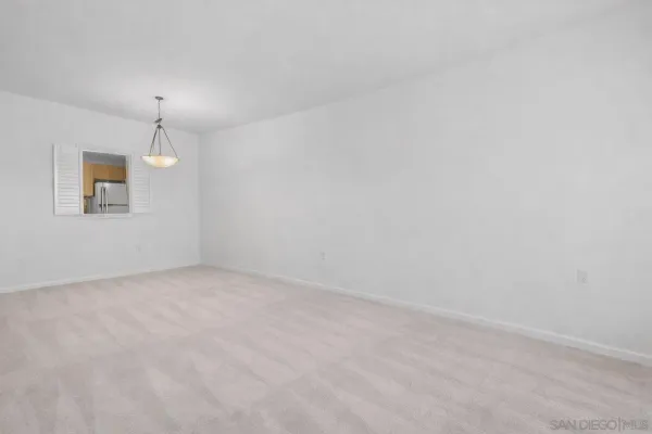 a view of empty room with windows