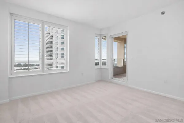 a living room with furniture a rug and a flat screen tv