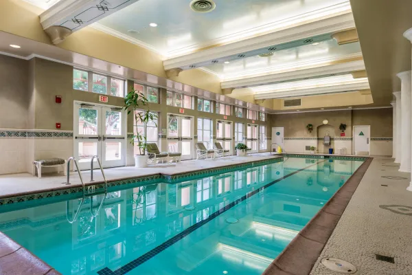 a room with a tub and windows