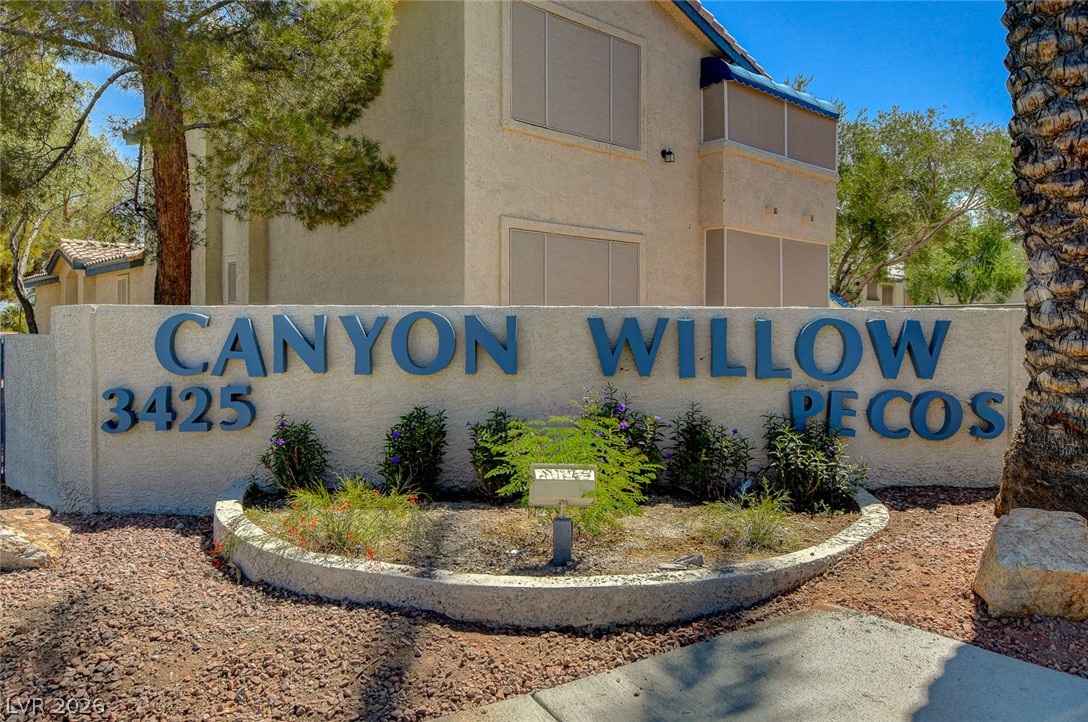 3425 East Russell Road, Unit 223 Las Vegas, NV 89120 - Photo 44 of 47 Bold lettering on a textured wall welcomes residents to this desert-landscaped community.