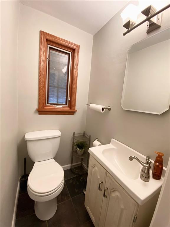 473 Old Farm Road Pittsburgh, PA 15228 - Photo 16 of 23 a bathroom with a toilet sink and mirror
