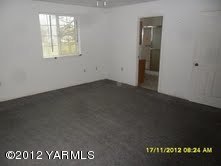 700 Outlook Road Outlook, WA 98938 - Photo 3 of 6 an empty room with a window