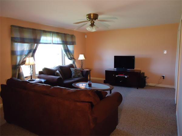 361 Hadley Road Sunderland, MA 01375 - Photo 12 of 22 a living room with furniture and a flat screen tv