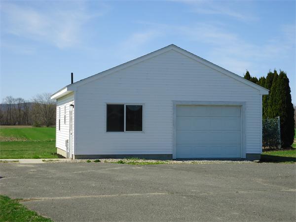 361 Hadley Road Sunderland, MA 01375 - Photo 5 of 22 a front view of house along with yard and garage