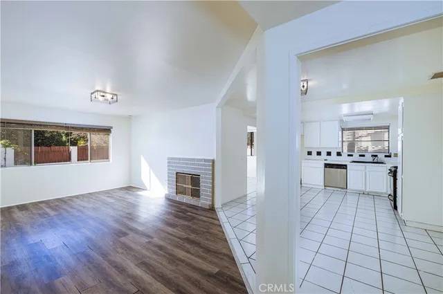 a view of a kitchen with microwave and cabinets