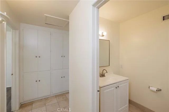 a bathroom with a sink and mirror