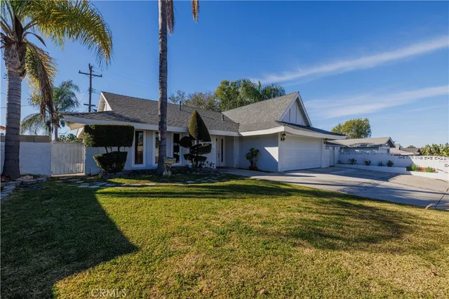 a view of house with swimming pool yard and outdoor seating