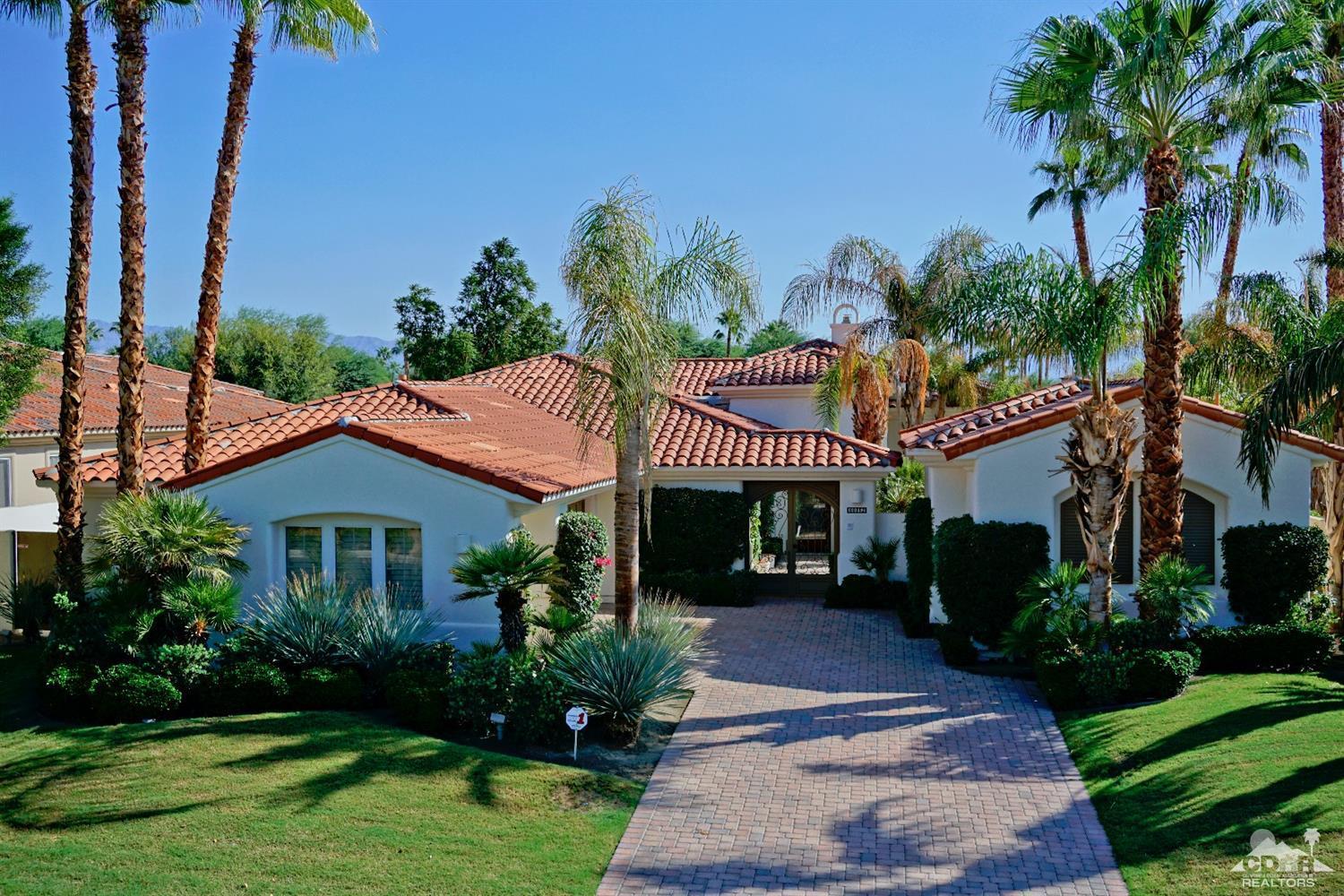 80352 Riviera La Quinta, CA 92253 - Photo 1 of 31 a front view of a house with a garden