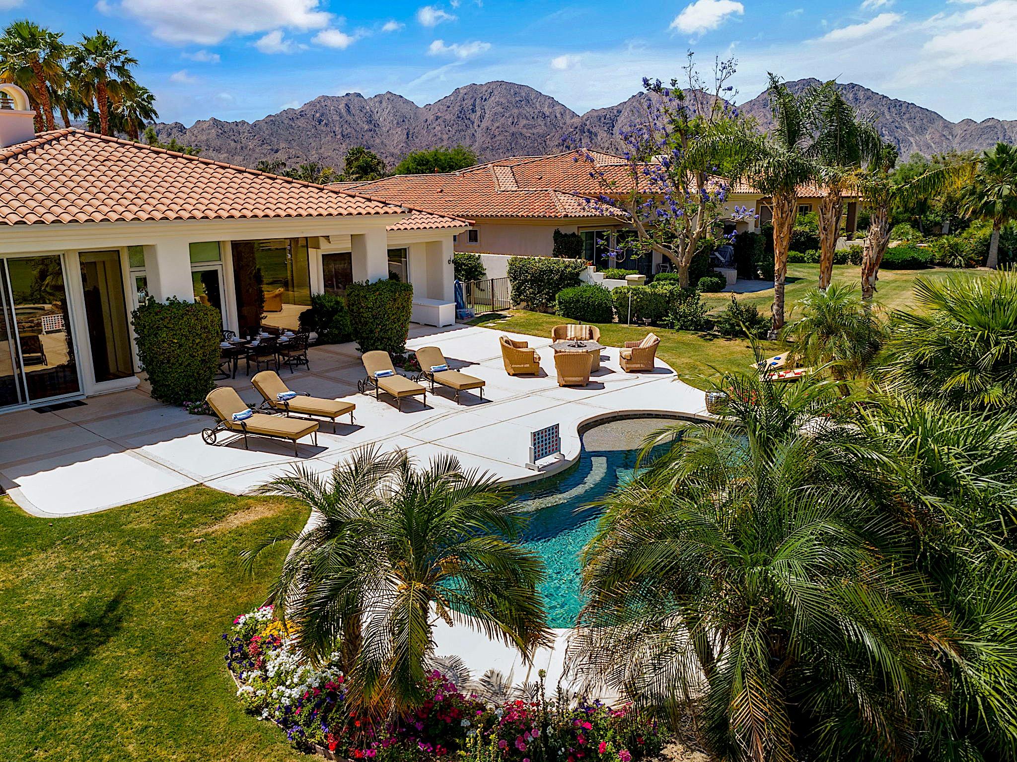 80352 Riviera La Quinta, CA 92253 - Photo 2 of 31 a view of a house with pool and chairs