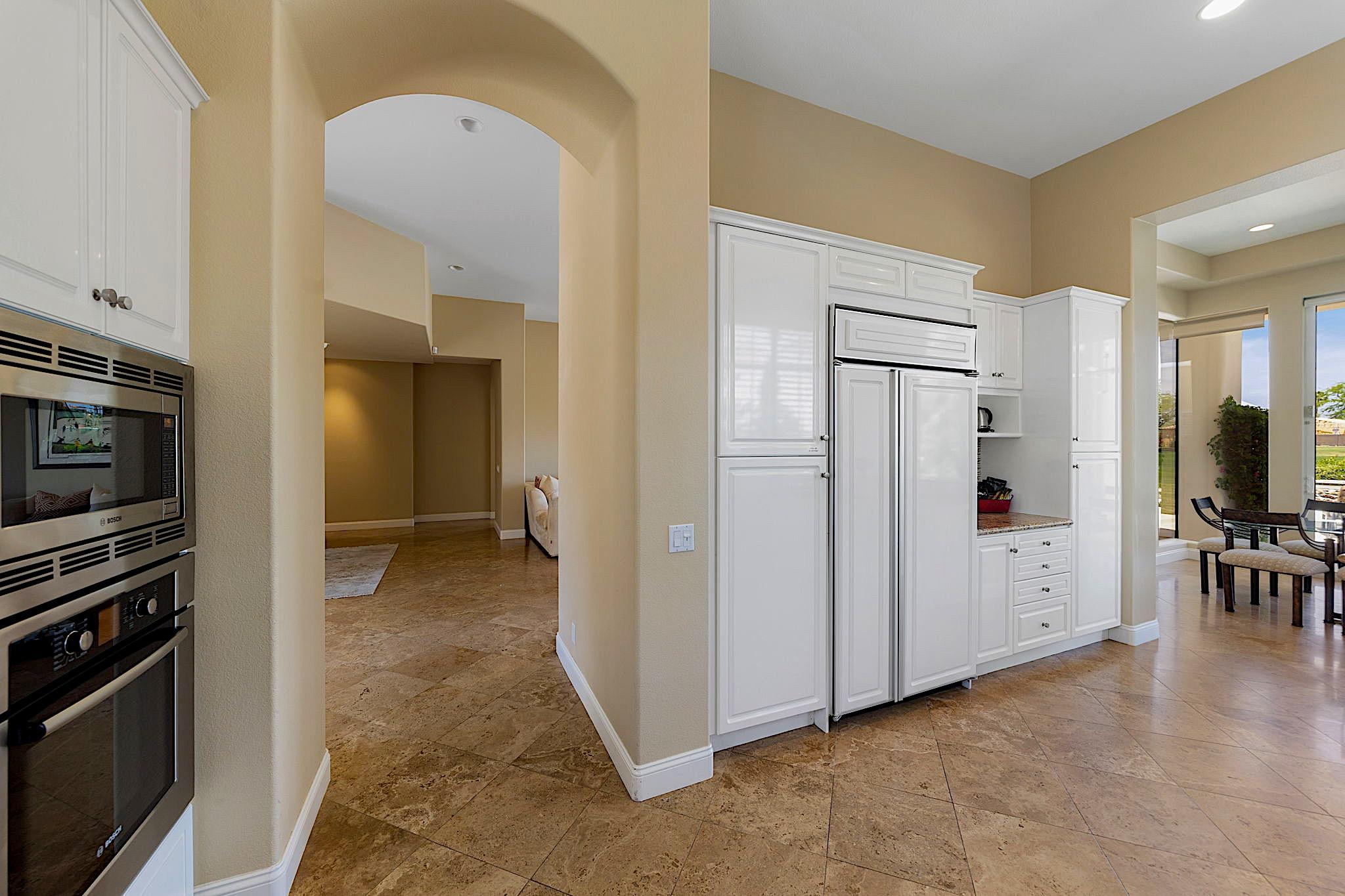 80352 Riviera La Quinta, CA 92253 - Photo 13 of 31 a view of a kitchen with furniture and an empty room