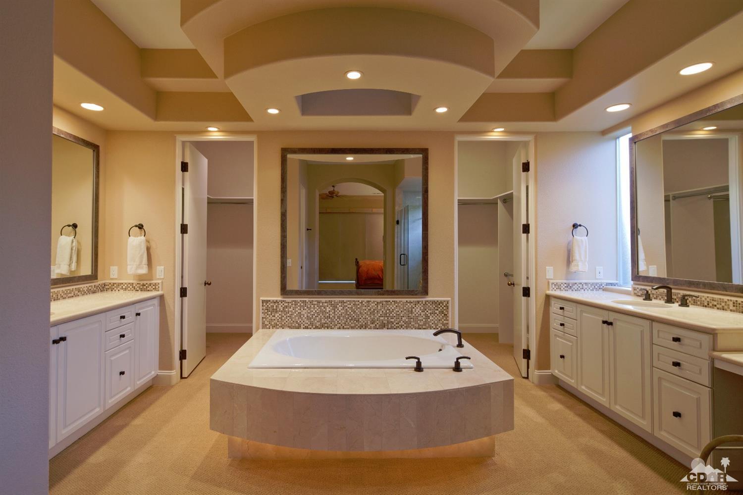 80352 Riviera La Quinta, CA 92253 - Photo 15 of 31 a spacious bathroom with a tub sink double vanity and a mirror