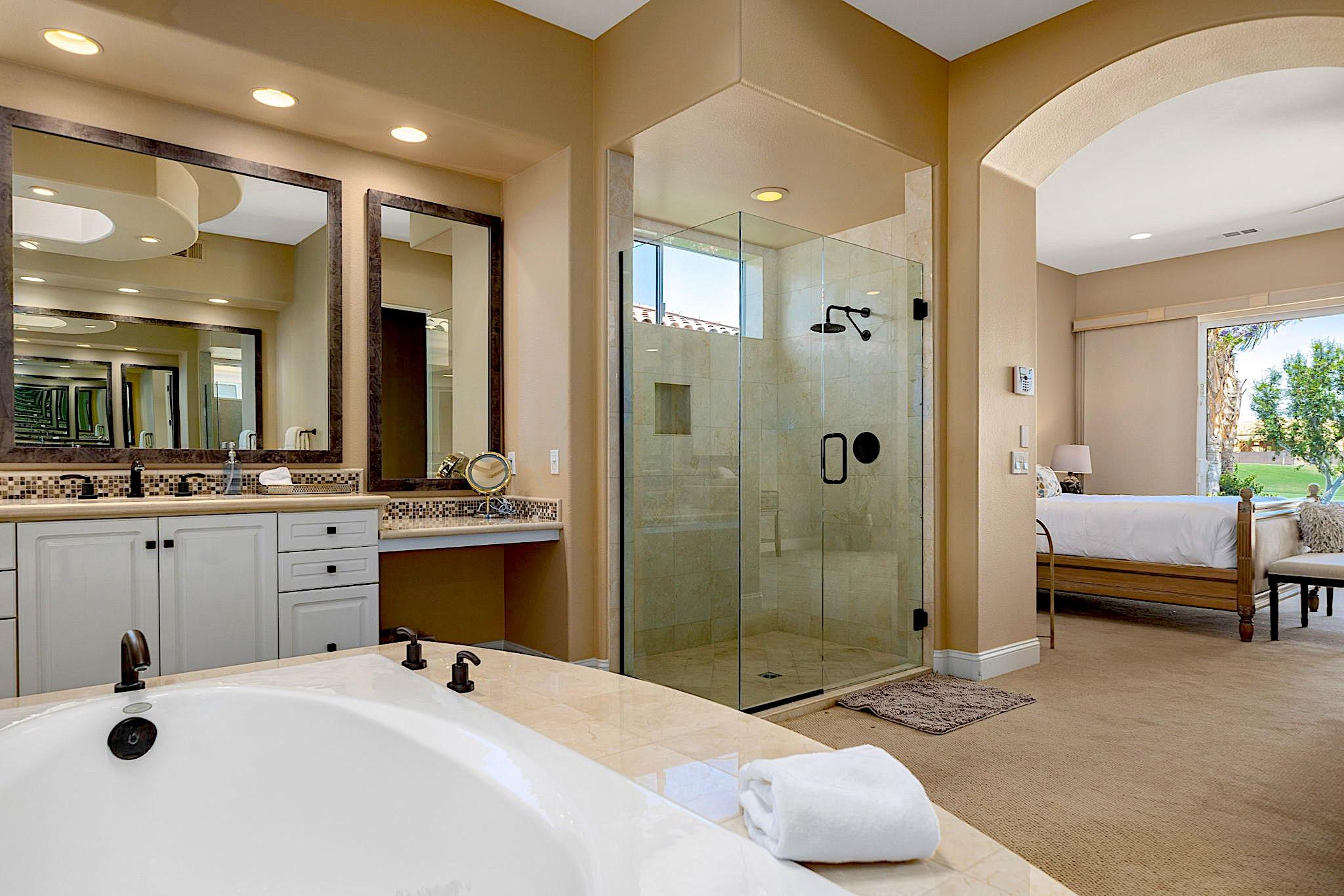 80352 Riviera La Quinta, CA 92253 - Photo 17 of 31 a bathroom with a tub sink and mirror