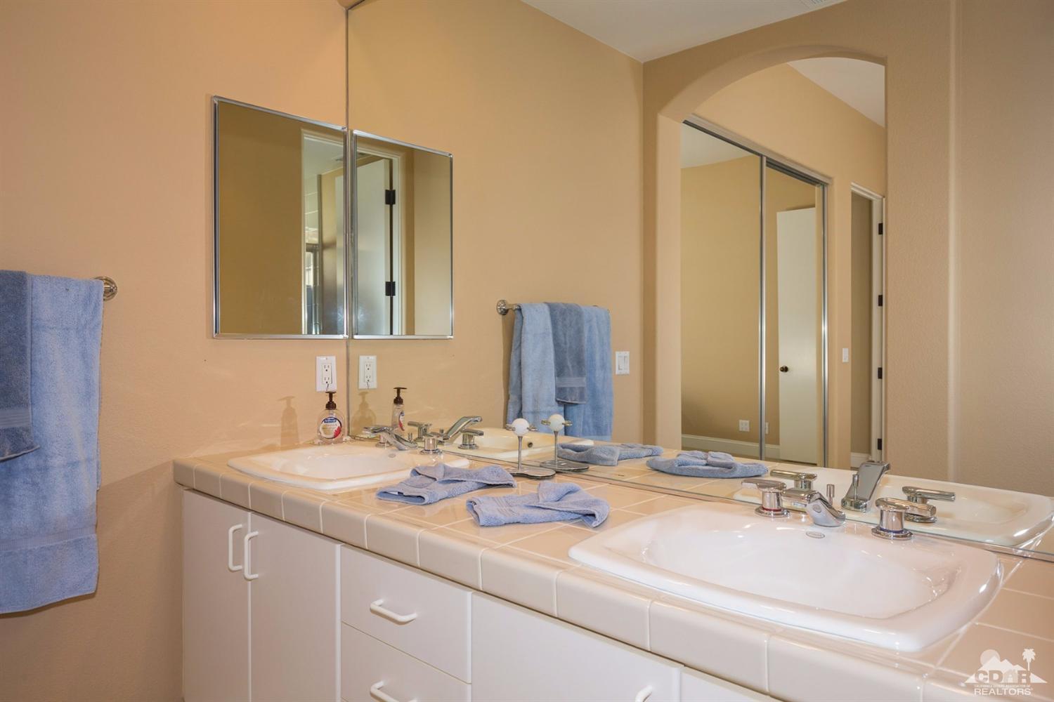 80352 Riviera La Quinta, CA 92253 - Photo 22 of 31 a bathroom with a double vanity sink and a mirror