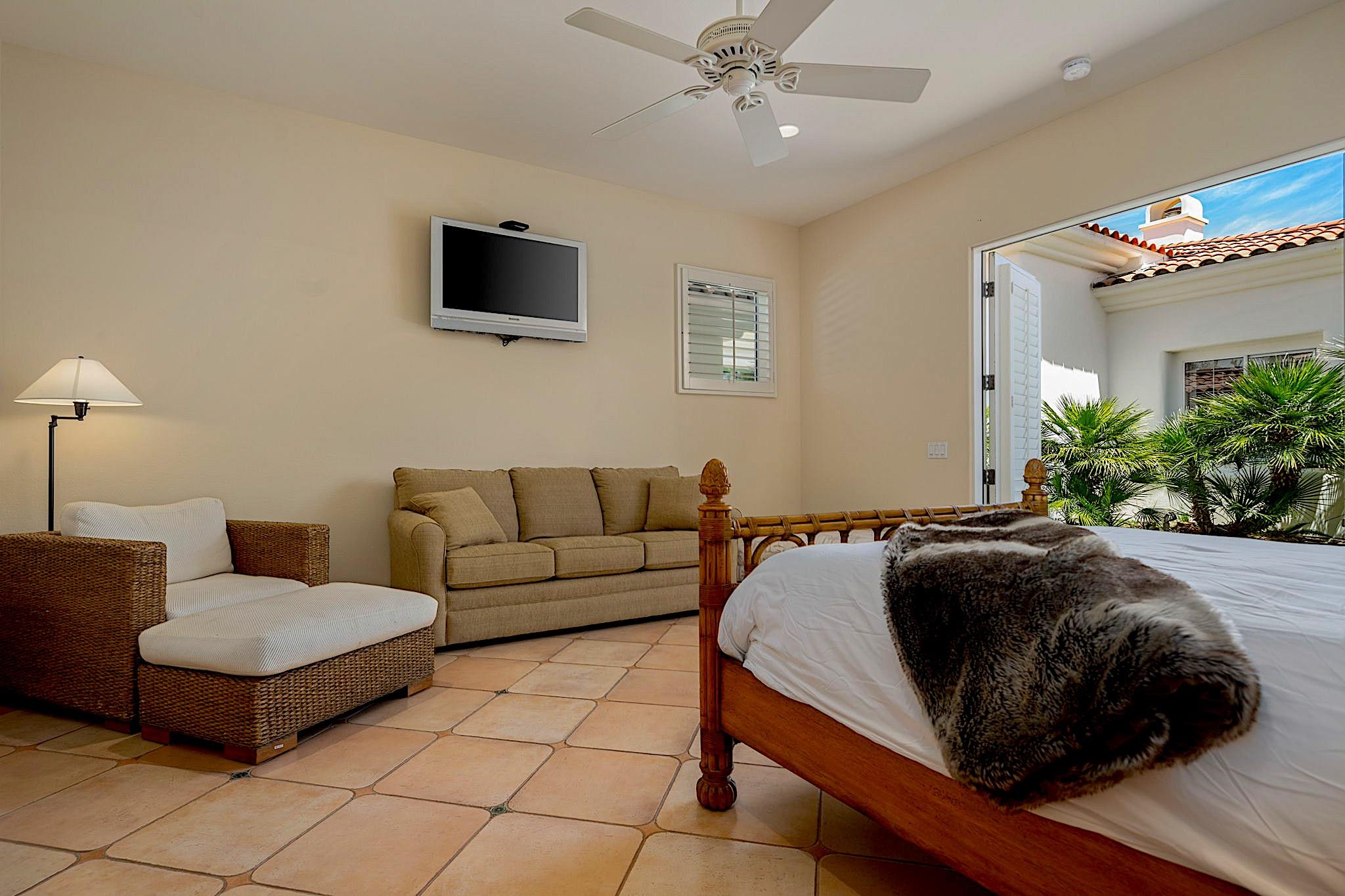 80352 Riviera La Quinta, CA 92253 - Photo 24 of 31 a living room with couches and a flat screen tv