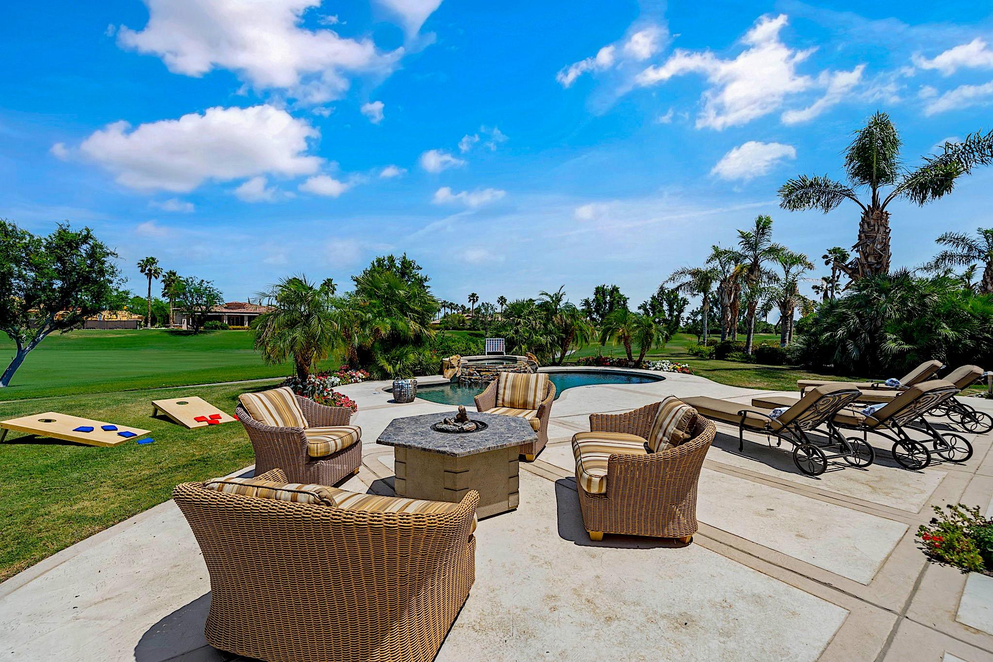 80352 Riviera La Quinta, CA 92253 - Photo 27 of 31 a view of a patio with couches and table and chairs and garden