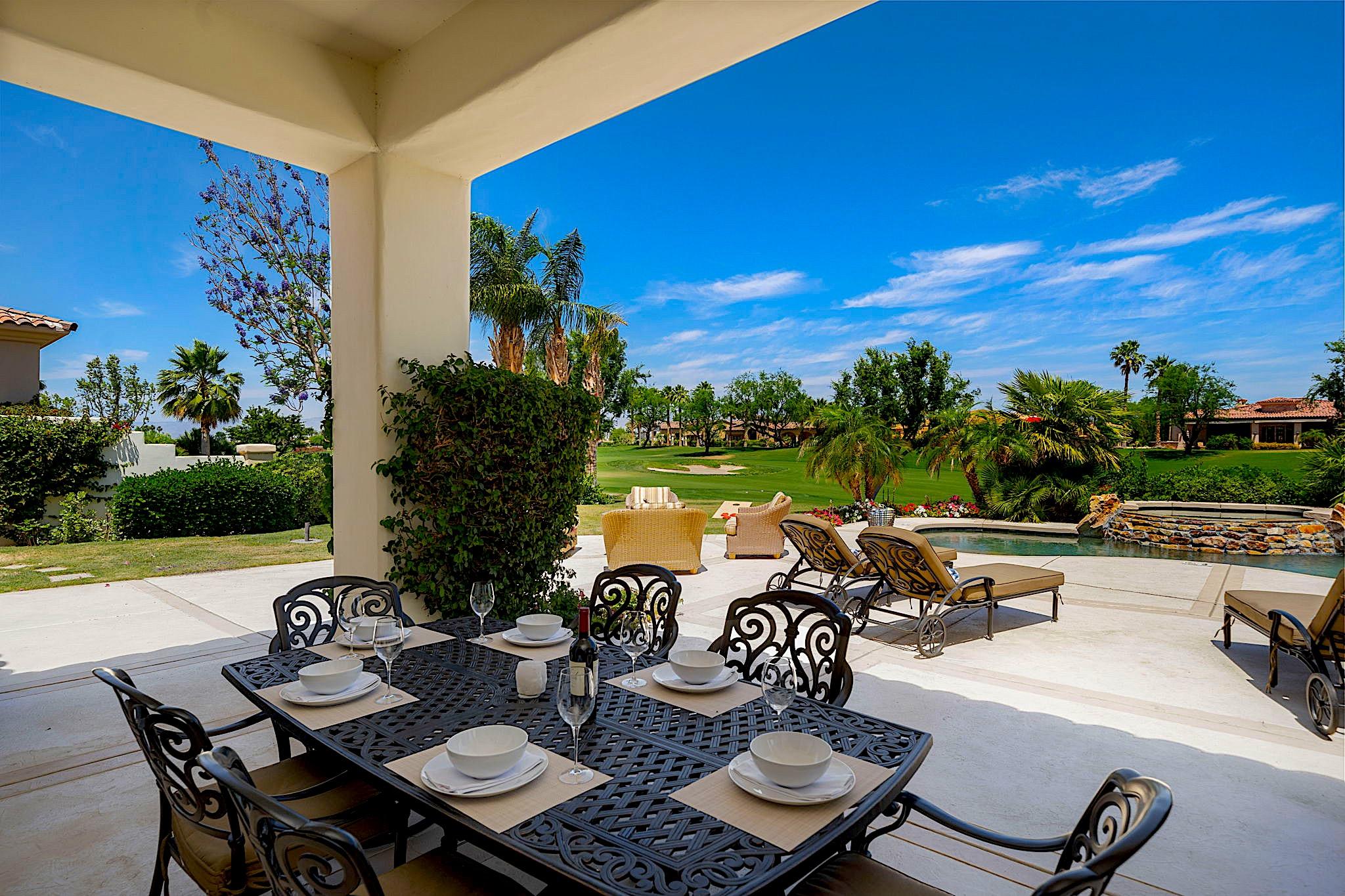 80352 Riviera La Quinta, CA 92253 - Photo 4 of 31 a view of a patio with table and chairs and potted plants