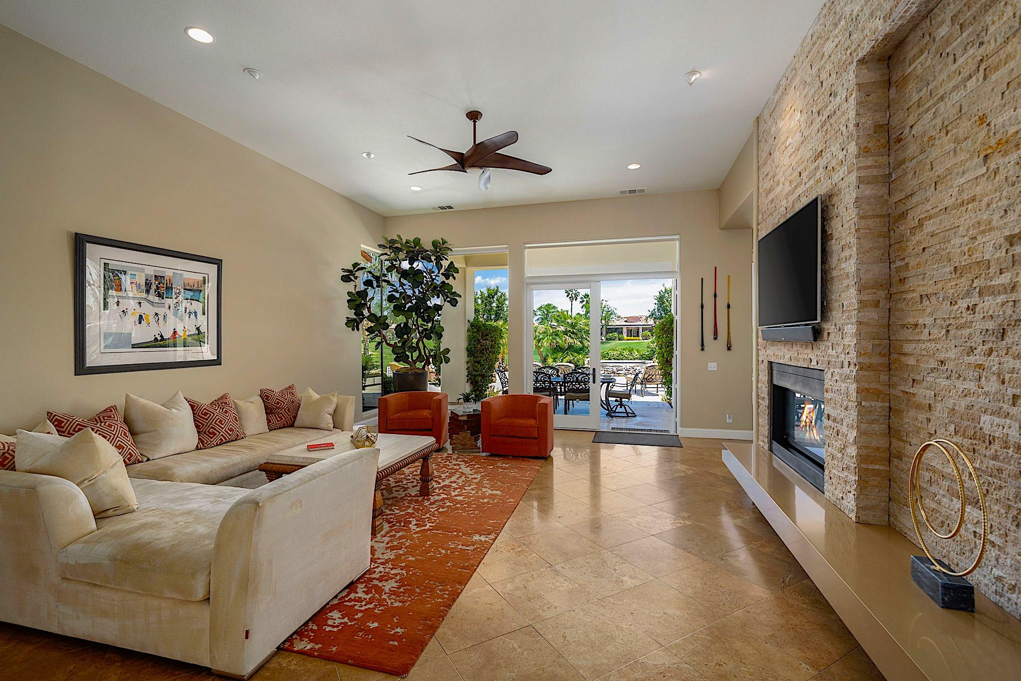 80352 Riviera La Quinta, CA 92253 - Photo 6 of 31 a living room with fireplace furniture and a flat screen tv