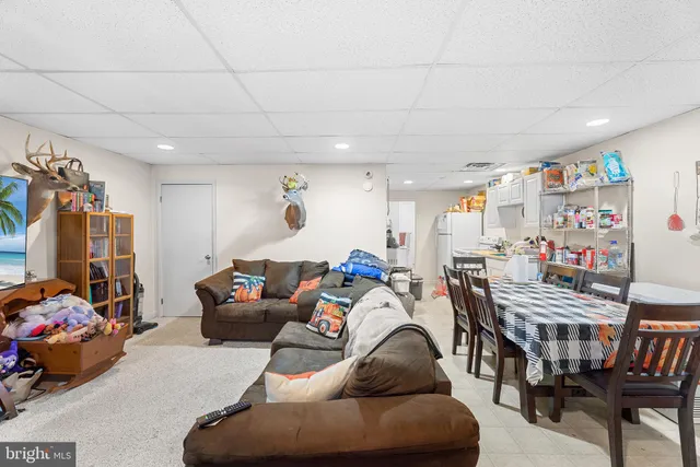 a living room with furniture and a table
