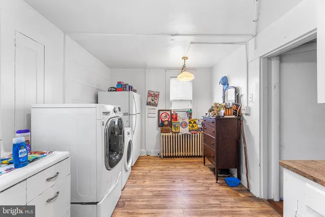 a view of storage and utility room with washer and dryer