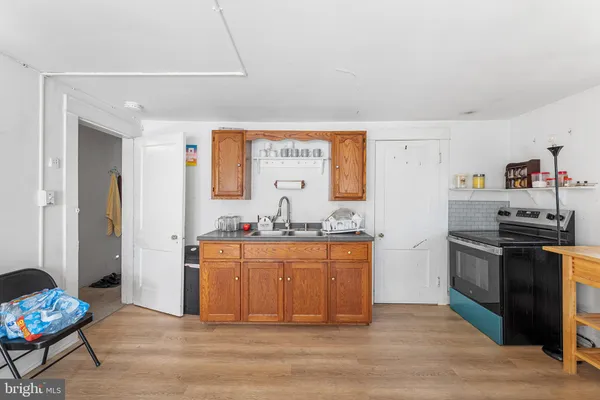 a kitchen with stainless steel appliances granite countertop a stove and a refrigerator