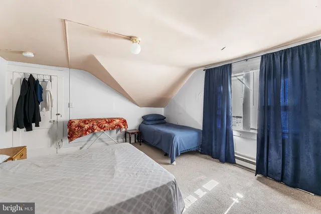 a bedroom with a bed and a walk in closet