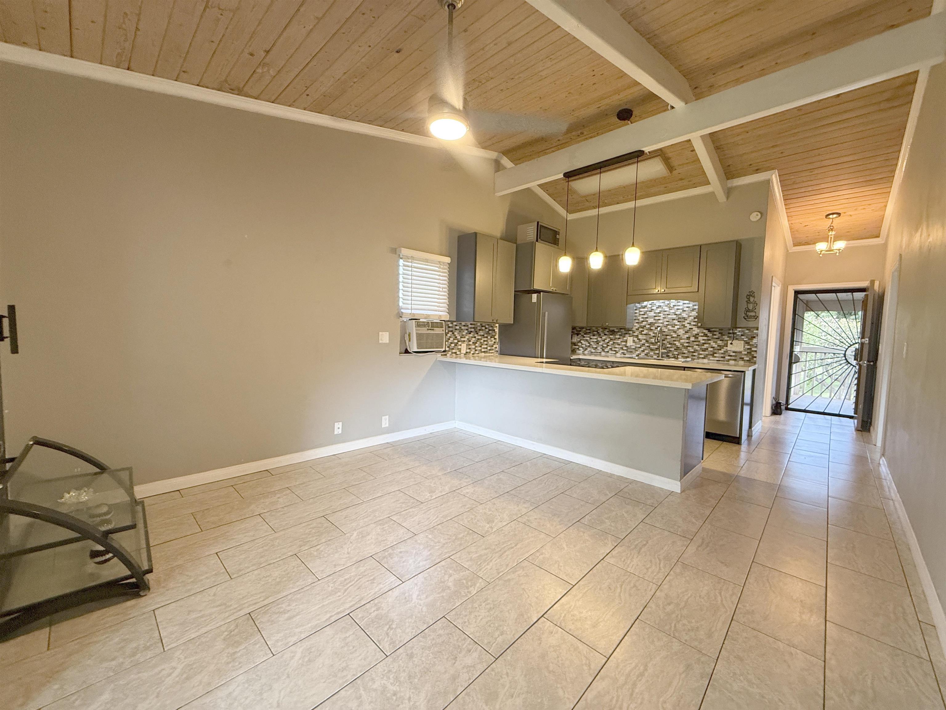 4435 Lower Honoapiilani Road, Unit 235 Lahaina, HI 96761 - Photo 13 of 21 a view of a hallway with a chandelier