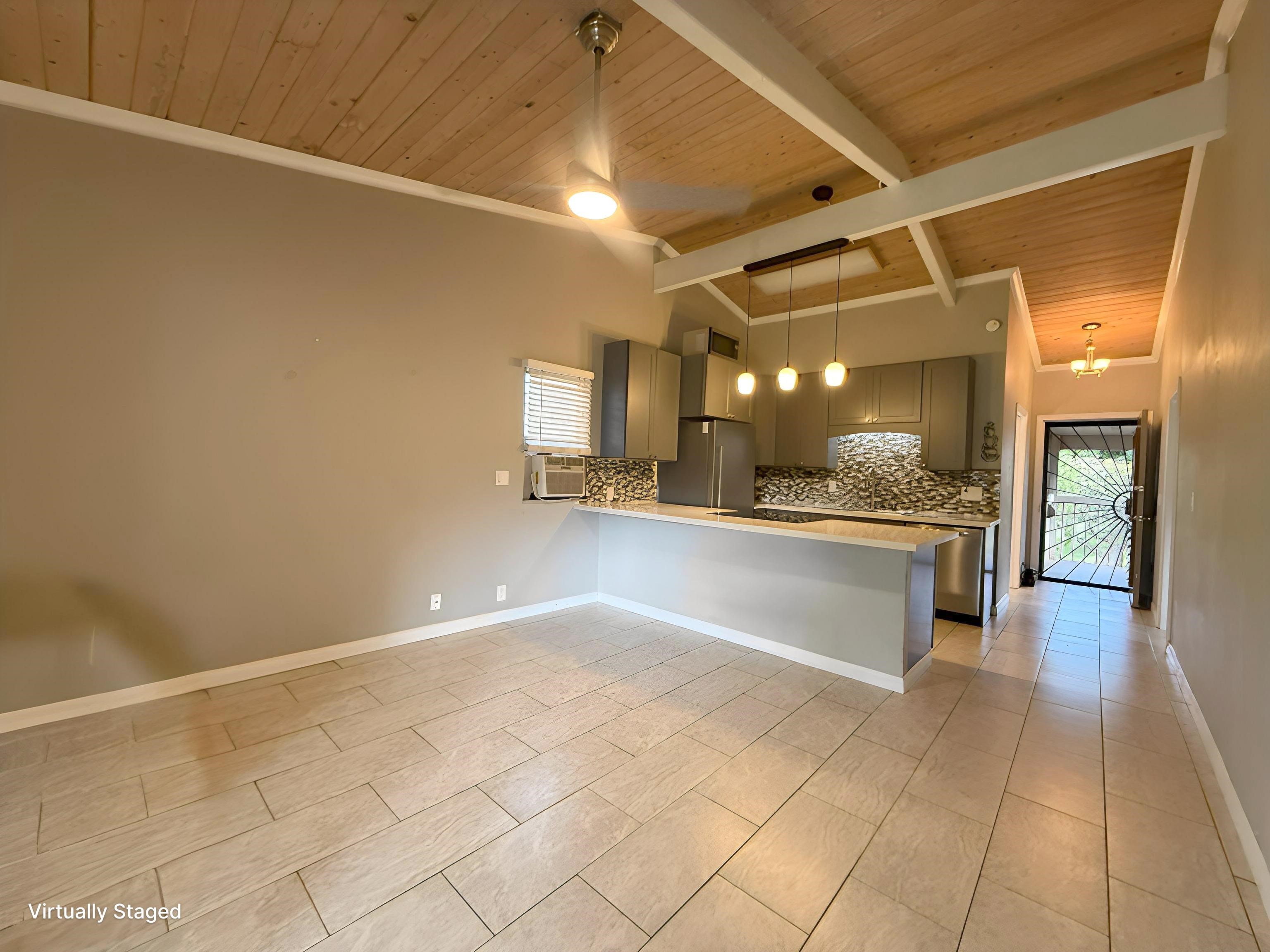 4435 Lower Honoapiilani Road, Unit 235 Lahaina, HI 96761 - Photo 2 of 21 a large white kitchen with a large window