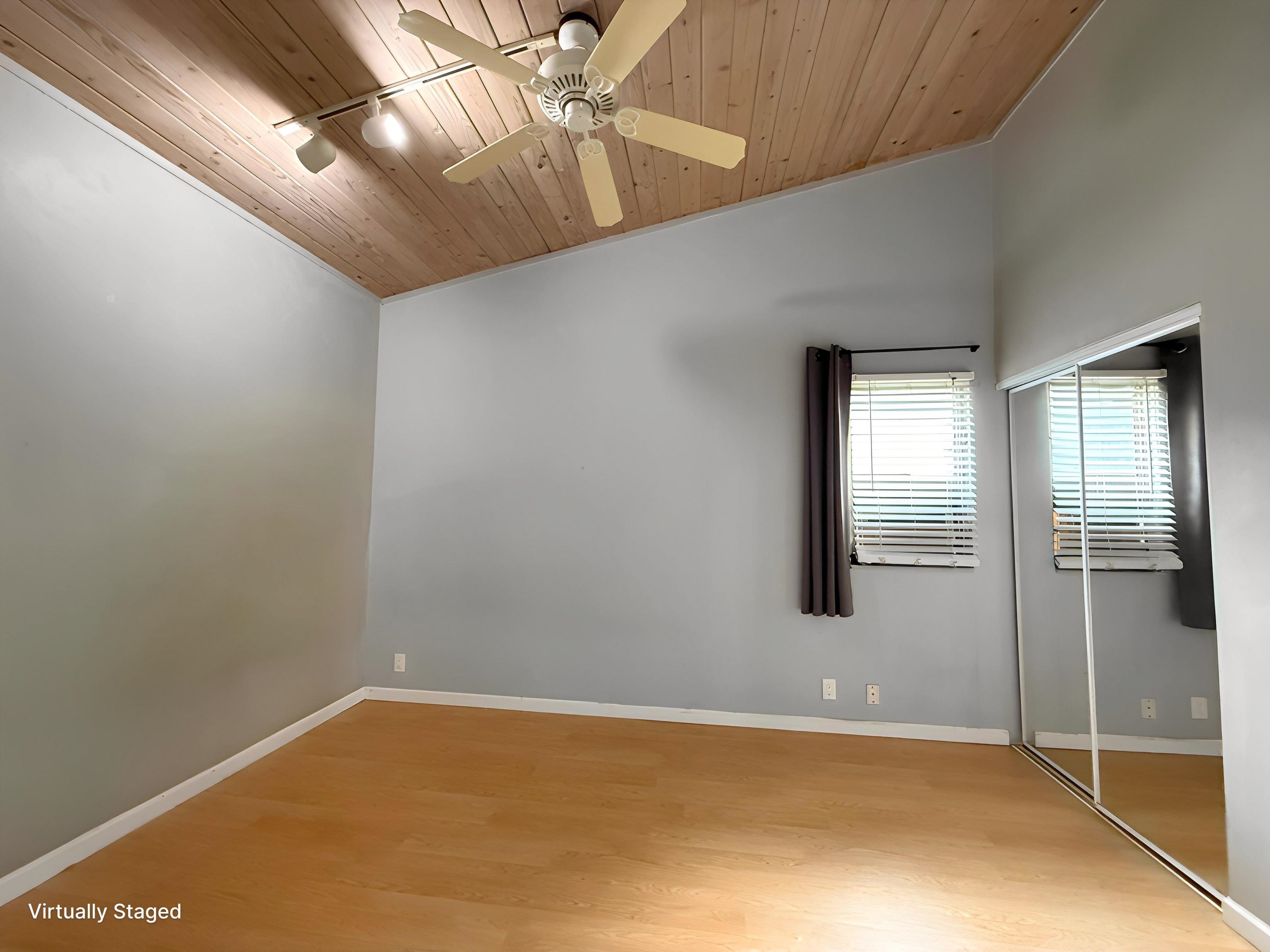 4435 Lower Honoapiilani Road, Unit 235 Lahaina, HI 96761 - Photo 7 of 21 en empty room with windows and fan