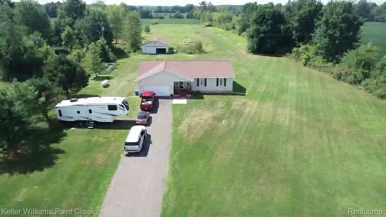 625 Howell Road Allenton, MI 48002 - Photo 3 of 46 Single-story residence with a light-colored exterior and a brown roof