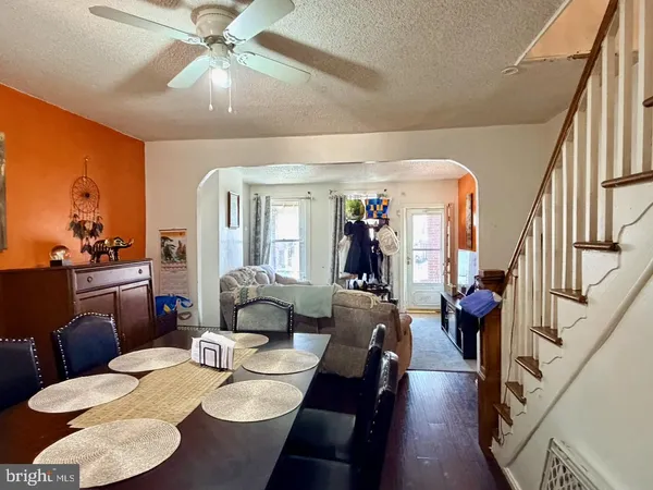 a view of a dining room with furniture and a chandelier