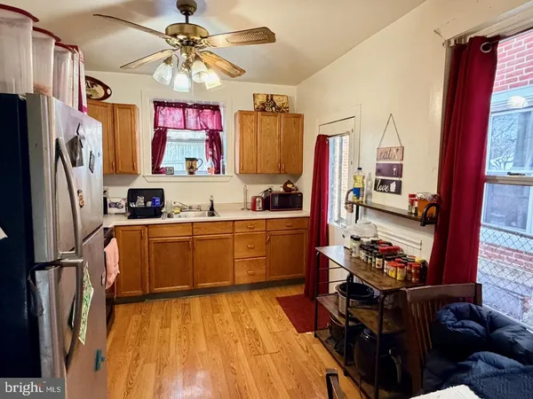 a kitchen with stainless steel appliances granite countertop a refrigerator stove and sink