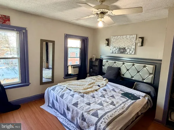 a bedroom with a bed and window