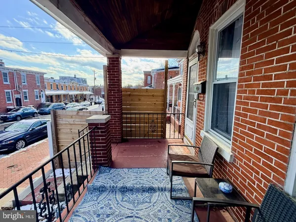 a view of a balcony with chairs
