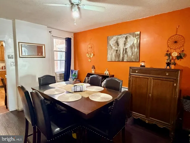 a view of a dining room with furniture and window