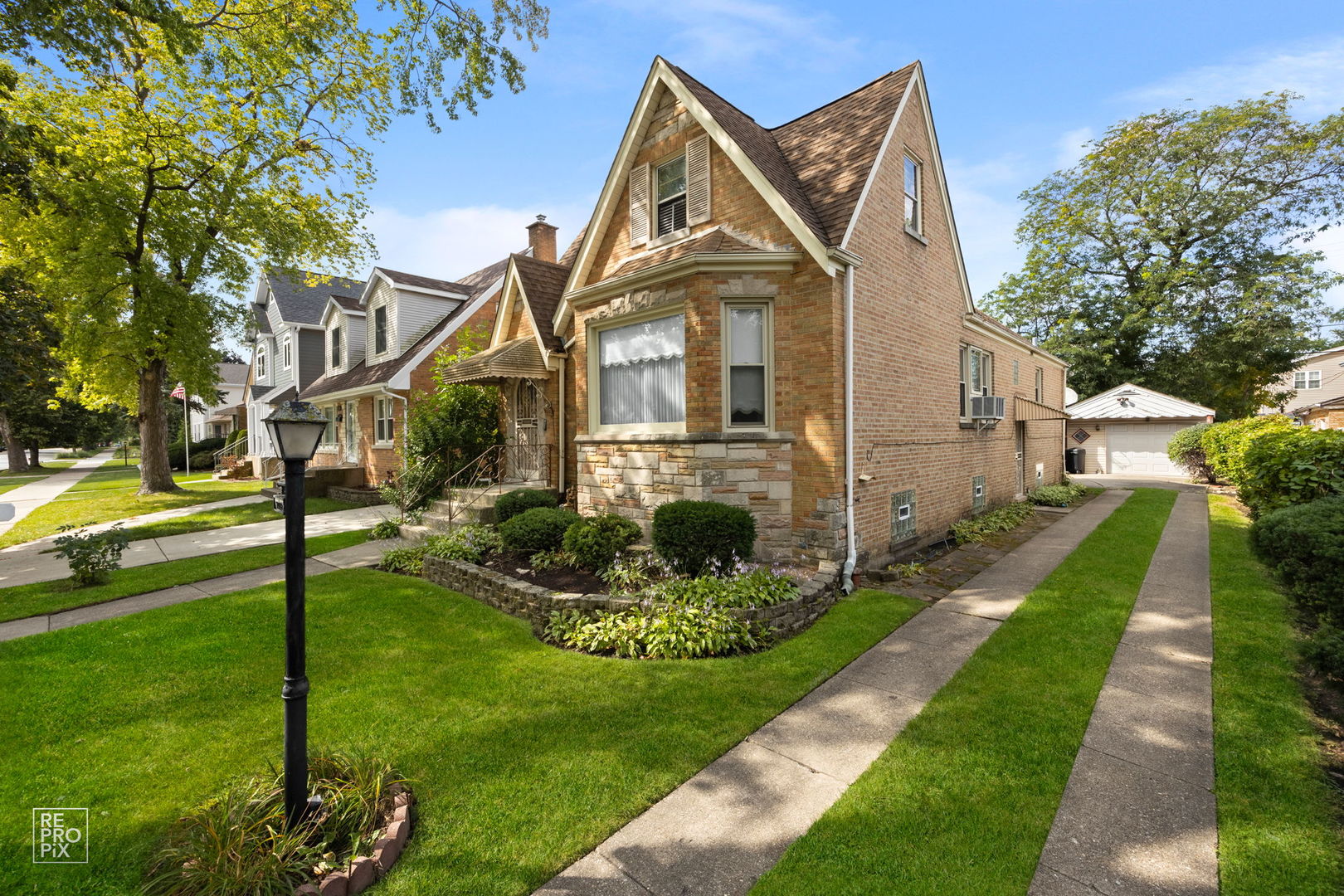 7322 North Octavia Avenue Chicago, IL 60631 - Photo 1 of 10 a front view of a house with a yard