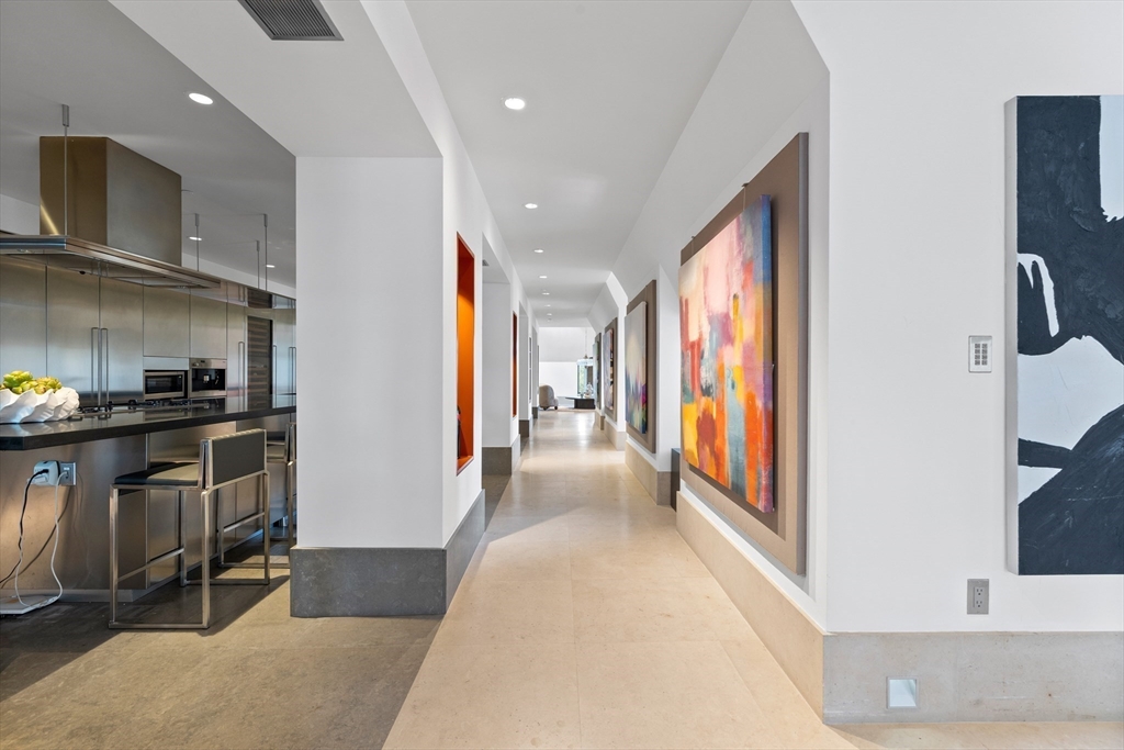 314 Commonwealth Avenue, Unit PH Boston, MA 02115 - Photo 13 of 41 a view of hallway with furniture and a kitchen