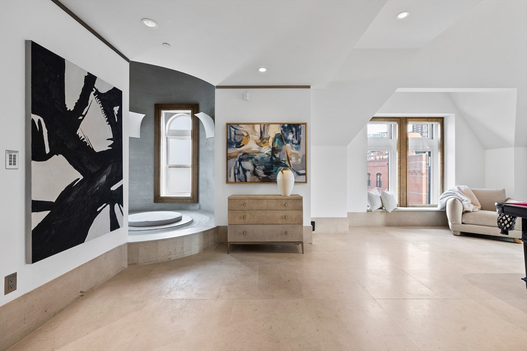 314 Commonwealth Avenue, Unit PH Boston, MA 02115 - Photo 18 of 41 a living room with furniture and a flat screen tv