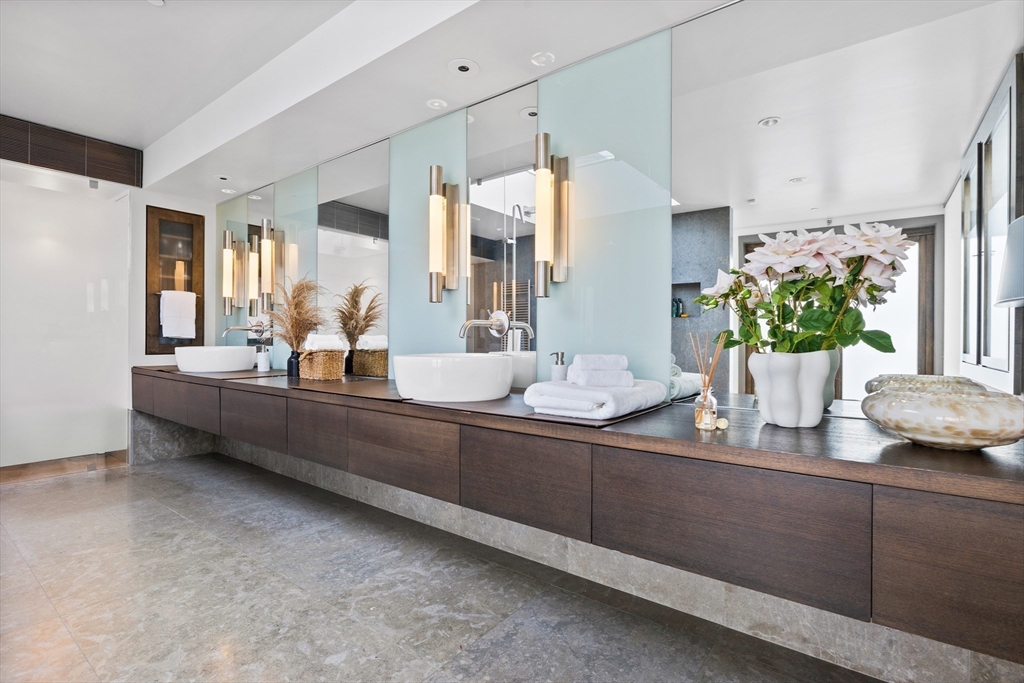 314 Commonwealth Avenue, Unit PH Boston, MA 02115 - Photo 33 of 41 a room with sink and mirror