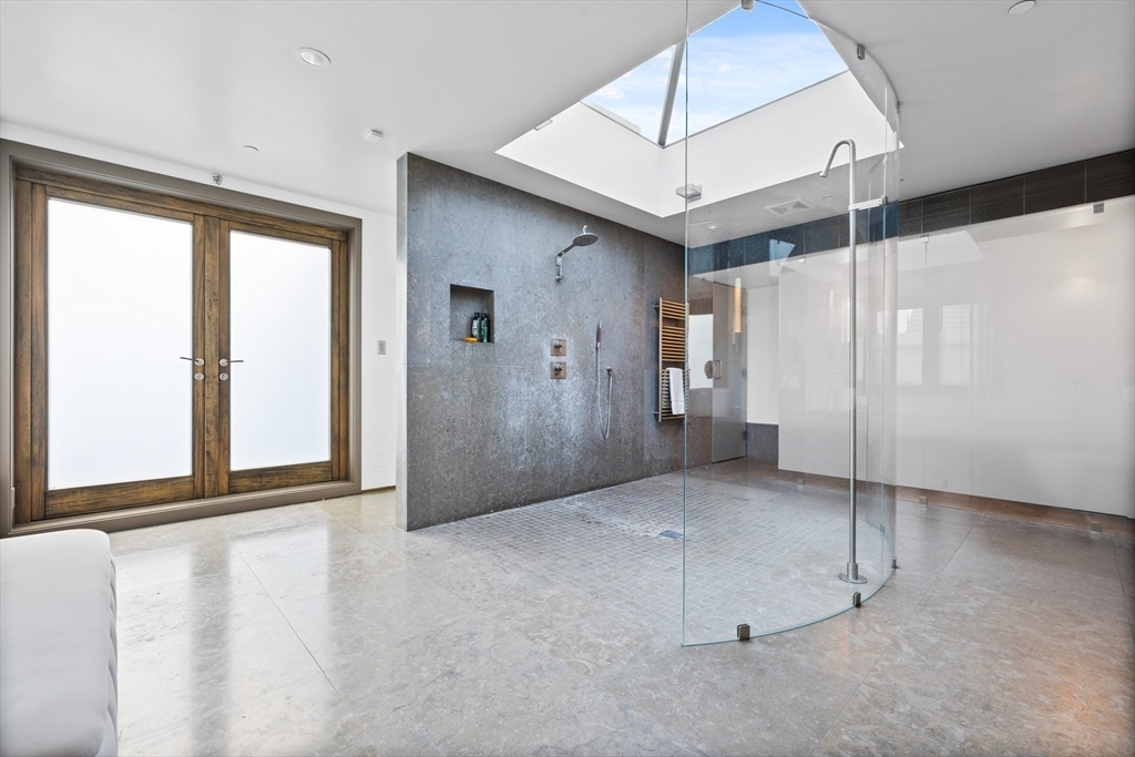 314 Commonwealth Avenue, Unit PH Boston, MA 02115 - Photo 34 of 41 a view of an empty room with a window