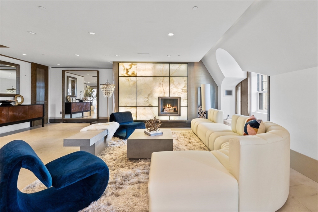 314 Commonwealth Avenue, Unit PH Boston, MA 02115 - Photo 5 of 41 a living room with furniture and a large window