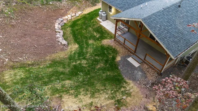a backyard of a house with lots of green space