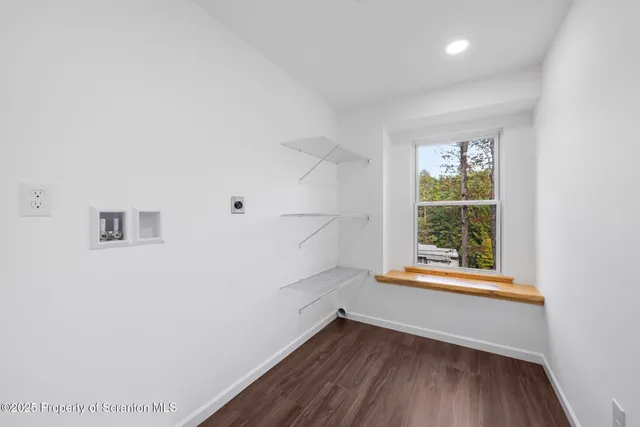 a view of room with window and hardwood floor