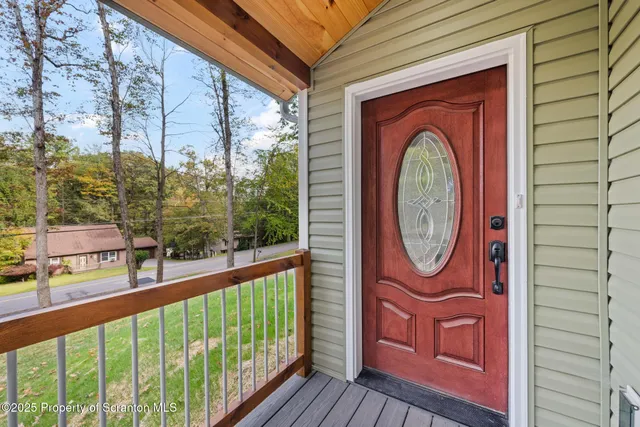 a view of a brick house with a large windows